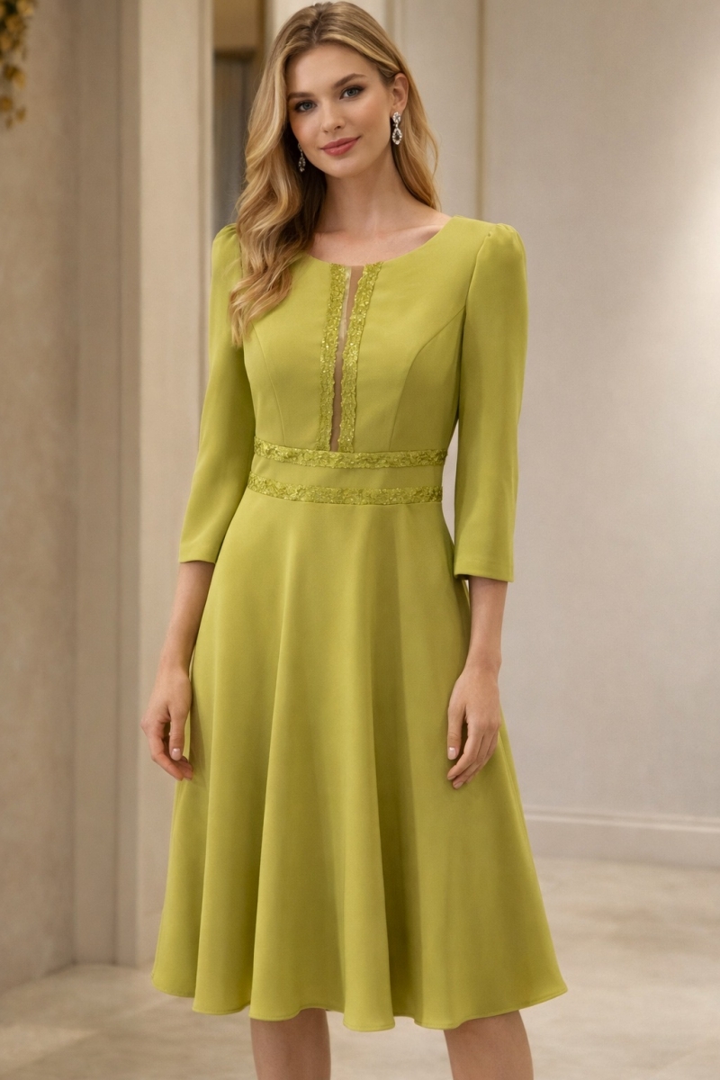 MOD.831 NATI JIMENEZ Vestido midi en tono pistacho, con falda de vuelo y corte a la cintura que realza la silueta de forma elegante.